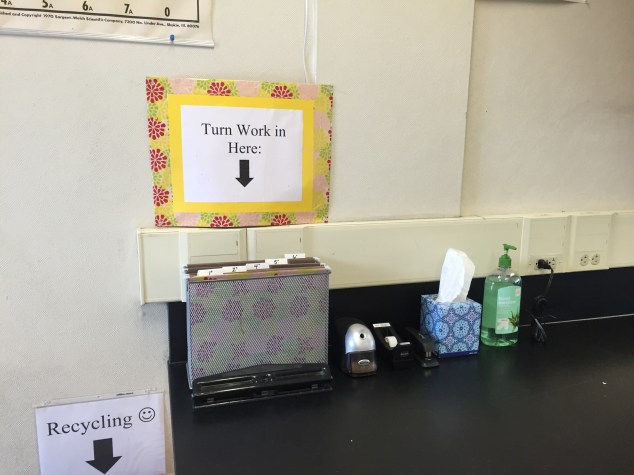 This is one of three student stations around the room. At this station students can sharpen their pencils, turn in their finished work, staple their work, three-hole-punch their work, use tape, blow their nose, and sanitize their hands! Each of my stations have all of the same supplies. See one of my other stations below.